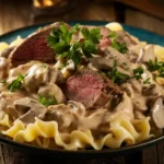 Creamy beef stroganoff served over egg noodles