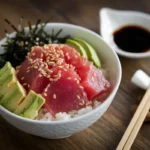 Fresh poke bowl with ahi tuna, avocado, and seaweed.